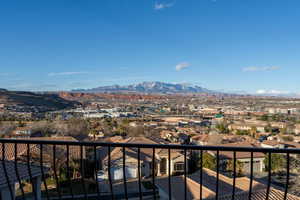 Balcony featuring a residential view and a mountain view