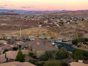 Aerial view at dusk featuring a residential view and a mountain view