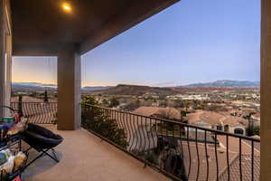 Balcony featuring a residential view and a mountain view