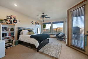 Bedroom featuring a ceiling fan, recessed lighting, light colored carpet, and a mountain view