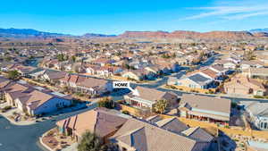 Birds eye view of property with a residential view and a mountain view