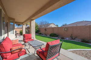 View of patio featuring an outdoor hangout area and a fenced backyard