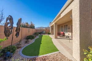 View of yard featuring a patio area and a fenced backyard