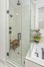 Bathroom featuring a shower stall