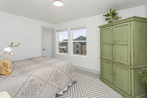 Bedroom with carpet floors and baseboards