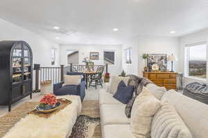 Living area featuring recessed lighting and light carpet