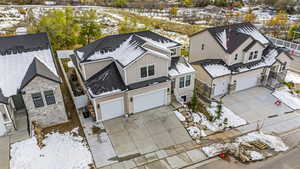 Snowy aerial view with a residential view