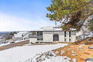 Mid-century modern home with brick siding