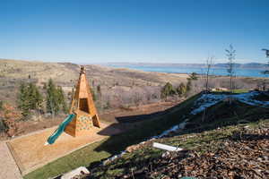 Exterior space with a water and mountain view