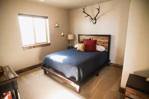 Carpeted bedroom with baseboards