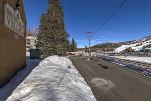 View of road with street lighting and a mountain view