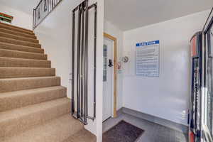 Staircase with tile patterned floors