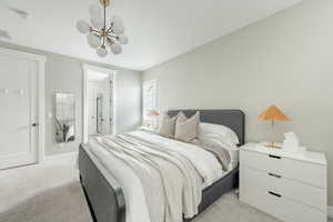 Bedroom featuring visible vents, a chandelier, baseboards, and light colored carpet