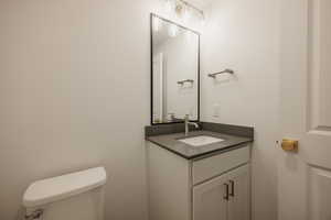 Bathroom featuring toilet and vanity