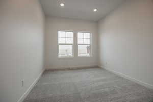 Empty room with baseboards, carpet flooring, and recessed lighting