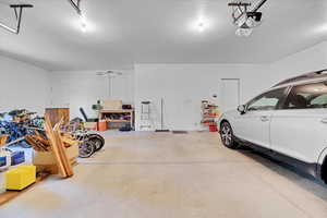 Garage featuring a garage door opener