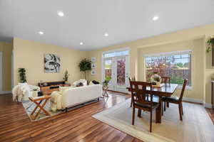 Dining space with recessed lighting, a wealth of natural light, and light wood-style floors