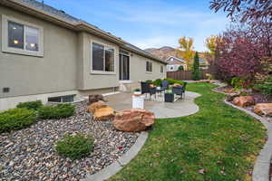 View of yard with fence and a patio