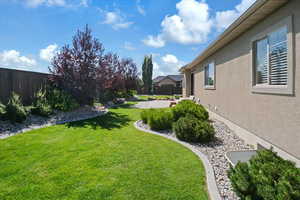 View of yard featuring a patio area and a fenced backyard