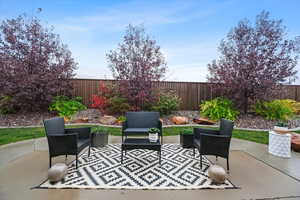 View of patio with a fenced backyard