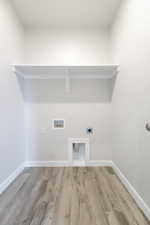 Laundry room with light wood-type flooring, washer hookup, laundry area, and hookup for an electric dryer