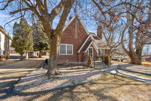 View of front of home featuring a front yard and central air condition unit