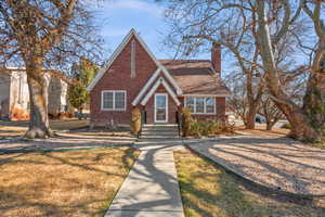 Tudor home featuring a front yard