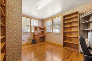 Unfurnished office with hardwood / wood-style floors