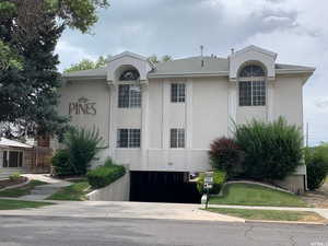 View of property featuring driveway