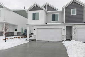 View of front of home featuring a garage