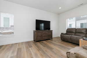 Living room with wood-type flooring