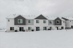 Exterior photo of back of home featuring patio