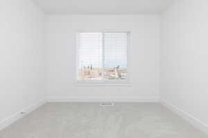 Empty room with carpet floors