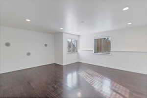 Work out room or 6th bedroom featuring dark wood-style flooring, recessed lighting, and baseboards