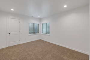 Carpeted Bedroom 5 with baseboards, visible vents, and recessed lighting