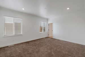 Primary bedroom room with baseboards, recessed lighting, and crown molding