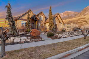 View of front of home featuring stone siding and a mountain view