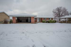 View of front of house with brick siding