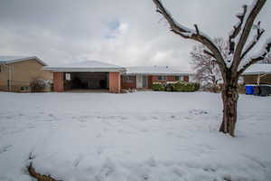 Single story home with a garage and brick siding