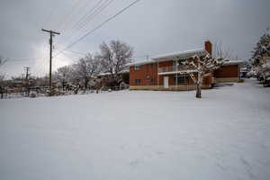 View of yard covered in snow