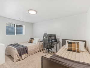 Bedroom featuring visible vents and carpet floors