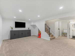 Interior space with recessed lighting, stairs, baseboards, and carpet floors