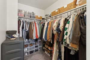 Spacious closet with carpet