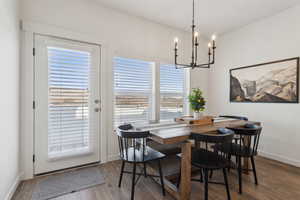 Dining room featuring baseboards and wood finished floors