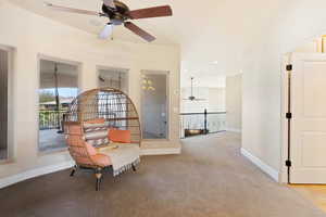 Sitting room with recessed lighting, light colored carpet, ceiling fan, and baseboards