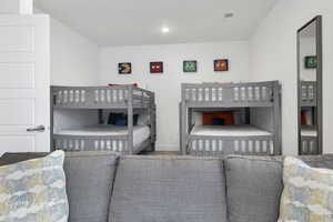 Bedroom featuring recessed lighting, visible vents, and baseboards