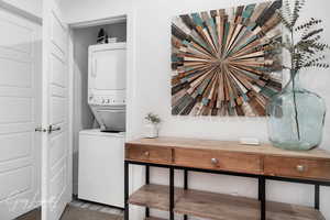 Laundry area featuring laundry area and stacked washer / dryer