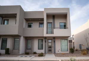 View of front of house featuring stucco siding