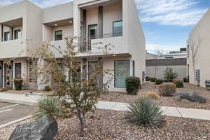 View of front of property featuring stucco siding