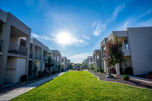 Surrounding community featuring a lawn and a residential view